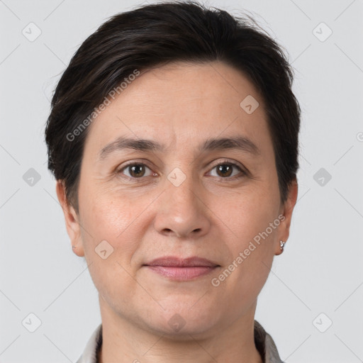 Joyful white adult female with short  brown hair and brown eyes