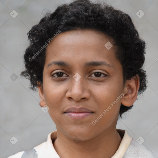 Joyful black young-adult female with short  brown hair and brown eyes