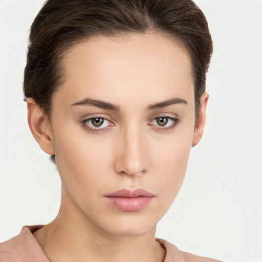 Neutral white young-adult female with short  brown hair and brown eyes