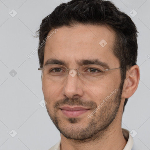 Joyful white adult male with short  brown hair and brown eyes