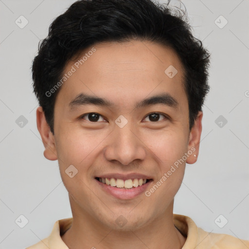 Joyful latino young-adult male with short  brown hair and brown eyes