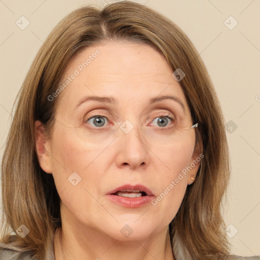 Joyful white adult female with medium  brown hair and grey eyes