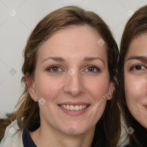 Joyful white young-adult female with medium  brown hair and blue eyes