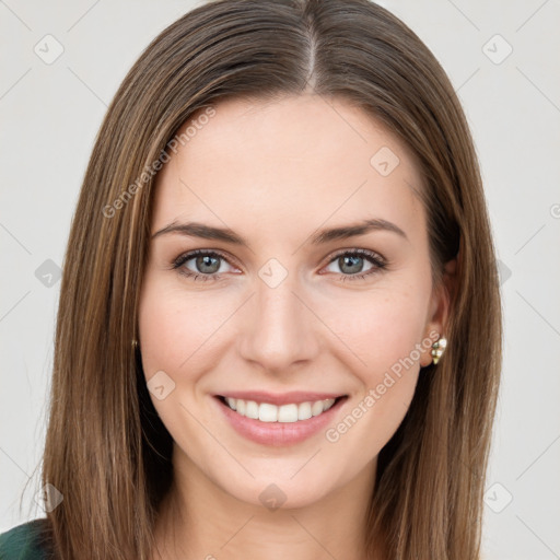 Joyful white young-adult female with long  brown hair and green eyes