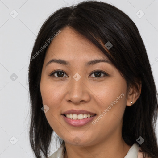 Joyful asian young-adult female with long  brown hair and brown eyes