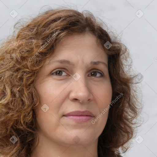 Joyful white adult female with long  brown hair and brown eyes