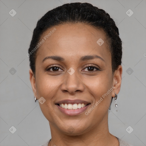 Joyful latino young-adult female with short  black hair and brown eyes