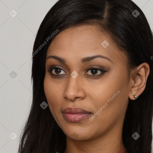 Joyful black young-adult female with long  brown hair and brown eyes