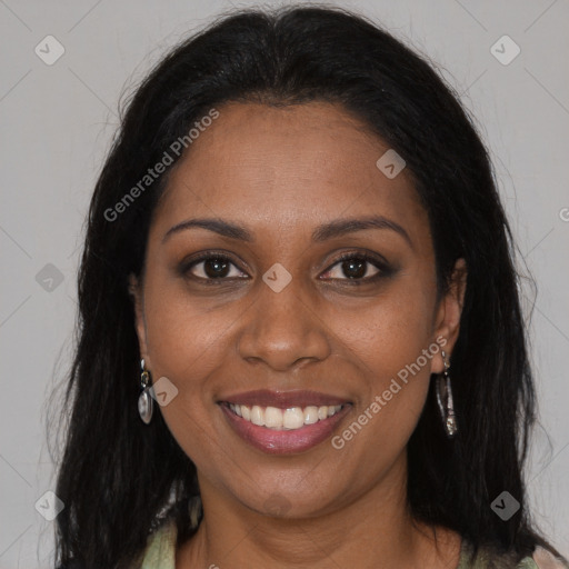 Joyful black young-adult female with long  brown hair and brown eyes