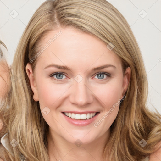 Joyful white young-adult female with long  brown hair and blue eyes