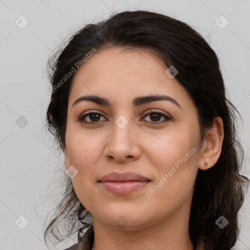 Joyful latino young-adult female with medium  brown hair and brown eyes