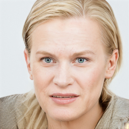 Joyful white young-adult female with long  brown hair and blue eyes