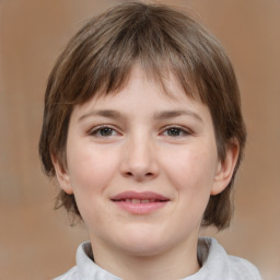 Joyful white child female with medium  brown hair and brown eyes