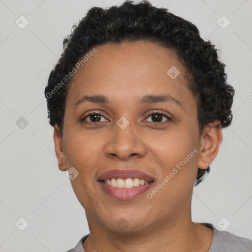 Joyful black young-adult female with short  brown hair and brown eyes