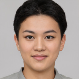 Joyful asian young-adult female with short  black hair and brown eyes