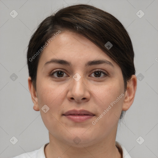 Joyful white adult female with short  brown hair and brown eyes