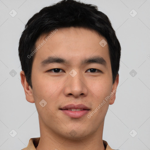 Joyful asian young-adult male with short  brown hair and brown eyes