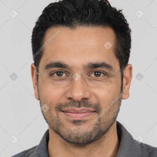 Joyful latino young-adult male with short  black hair and brown eyes