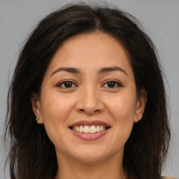 Joyful asian young-adult female with long  brown hair and brown eyes