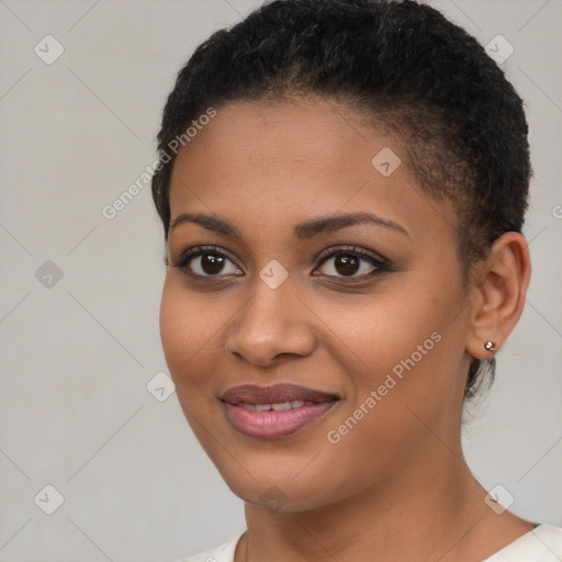 Joyful black young-adult female with short  brown hair and brown eyes