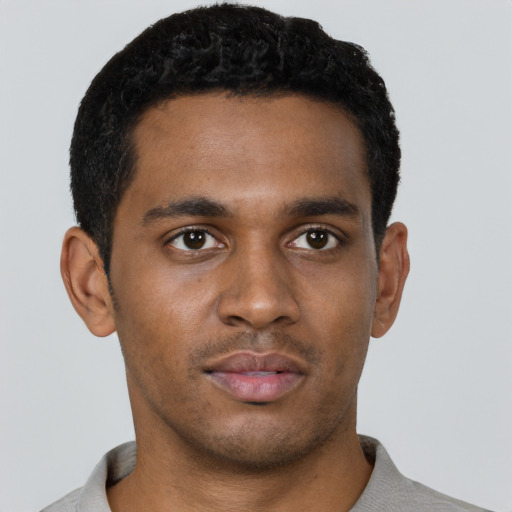 Neutral black young-adult male with short  black hair and brown eyes