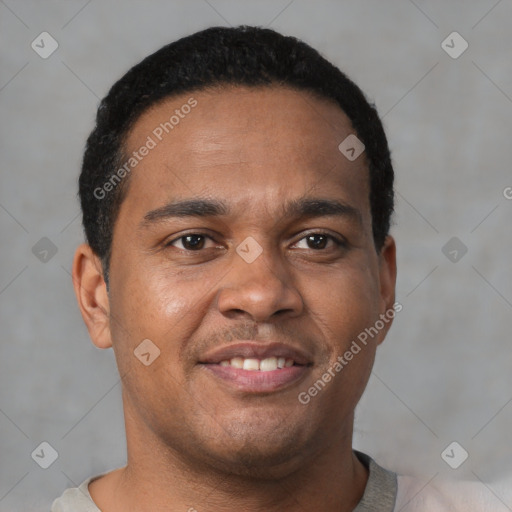 Joyful latino young-adult male with short  brown hair and brown eyes