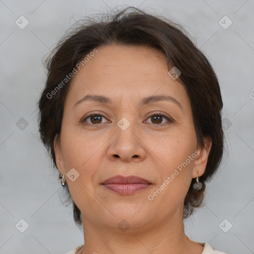 Joyful white adult female with medium  brown hair and brown eyes