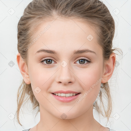 Joyful white child female with medium  brown hair and grey eyes