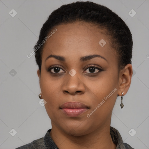 Joyful black young-adult female with short  black hair and brown eyes