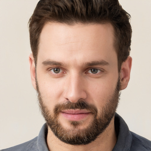 Joyful white young-adult male with short  brown hair and brown eyes