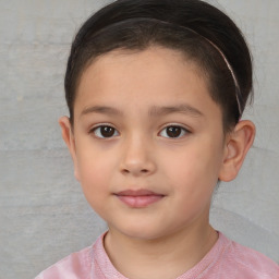 Joyful white child female with short  brown hair and brown eyes