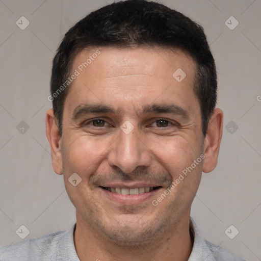 Joyful white adult male with short  brown hair and brown eyes