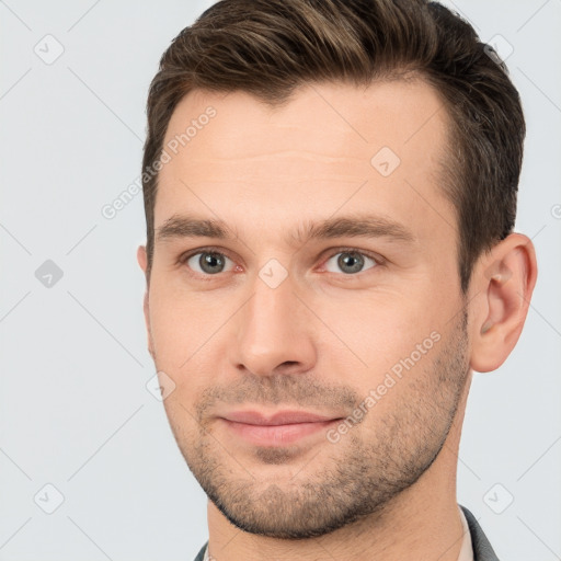 Joyful white young-adult male with short  brown hair and brown eyes