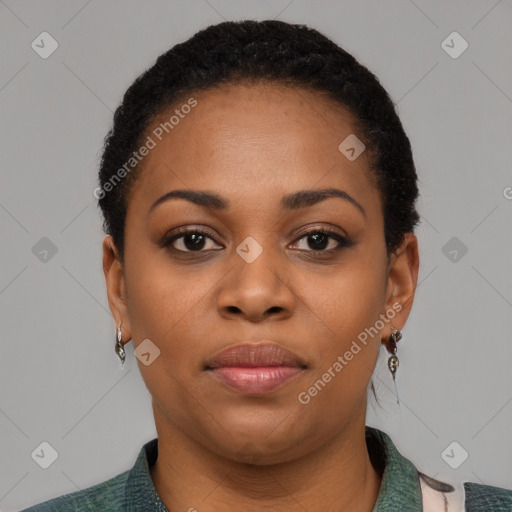 Joyful black young-adult female with short  black hair and brown eyes