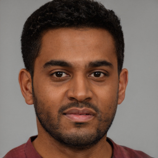 Neutral black young-adult male with short  black hair and brown eyes