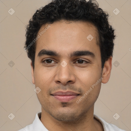 Joyful white young-adult male with short  black hair and brown eyes