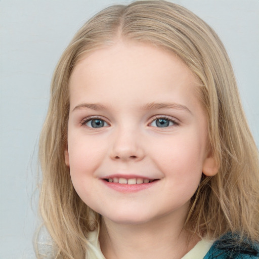 Joyful white child female with long  brown hair and blue eyes