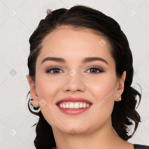 Joyful white young-adult female with long  black hair and brown eyes