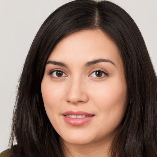 Joyful white young-adult female with long  black hair and brown eyes