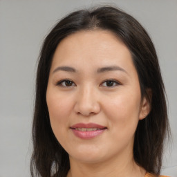 Joyful asian young-adult female with medium  brown hair and brown eyes