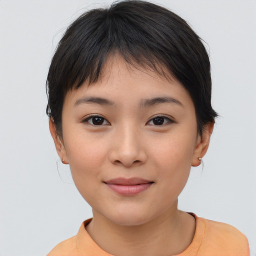 Joyful asian young-adult female with short  brown hair and brown eyes