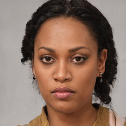 Neutral black young-adult female with long  brown hair and brown eyes