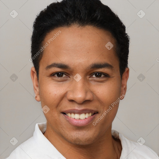 Joyful latino young-adult male with short  black hair and brown eyes