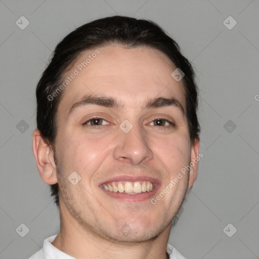 Joyful white adult male with short  brown hair and brown eyes