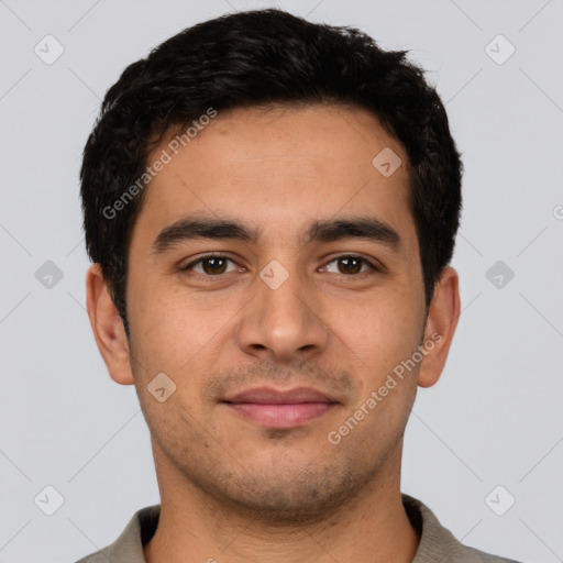 Joyful latino young-adult male with short  black hair and brown eyes