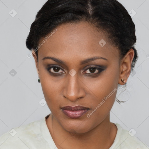 Joyful black young-adult female with short  brown hair and brown eyes