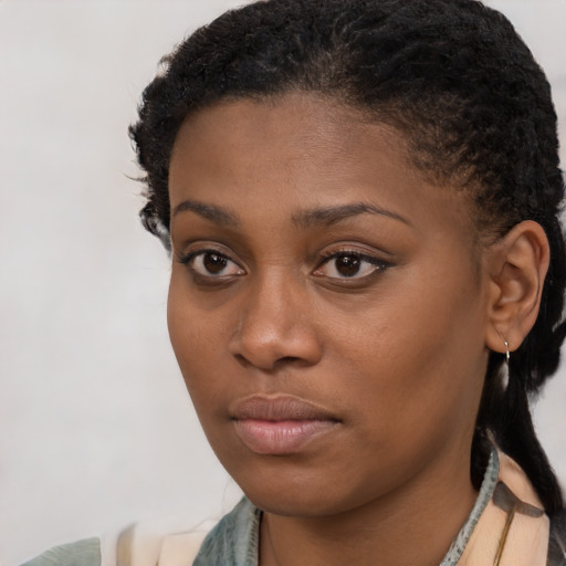 Neutral black young-adult female with short  brown hair and brown eyes