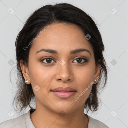 Joyful latino young-adult female with medium  brown hair and brown eyes