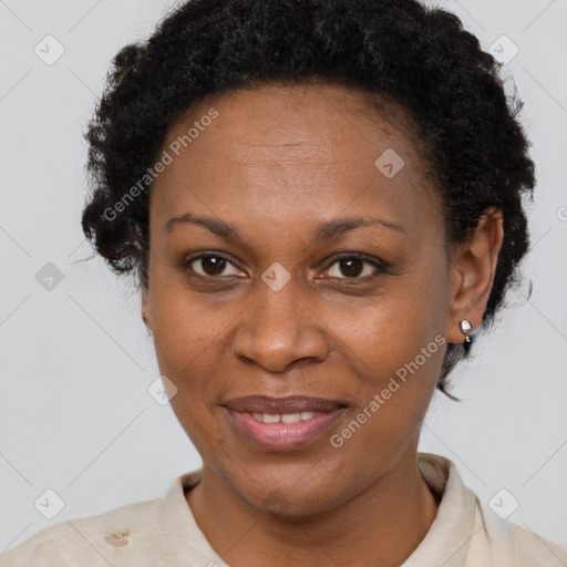 Joyful black adult female with short  brown hair and brown eyes