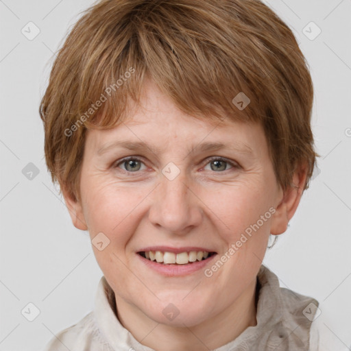 Joyful white adult female with short  brown hair and grey eyes